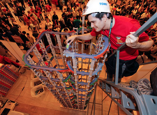 TOMY Master Builder Jason Moreno prepares to send a Chuggington die-cast railway train down a tower constructed of 17 feet, four inches of Chuggington StackTrack, which set the GUINNESS WORLD RECORDS Title for tallest toy train track Saturday, May 11, 2013 at Grand Central Terminal