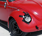 Ninja Cheerleaders Volkswagen Beetle damaged headlight detail